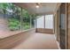 Screened porch provides an outdoor living space with views of a private, wooded yard at 1335 Seneca, Cumming, GA 30041