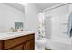 Bathroom featuring a single sink with a wood vanity, a white countertop, and a bathtub with a shower at 307 Ernest Ave, Peachtree City, GA 30269