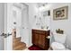 Bathroom with a modern vanity, toilet, and hardwood flooring at 307 Ernest Ave, Peachtree City, GA 30269