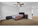 Neutral bedroom with a ceiling fan, window, and furniture at 307 Ernest Ave, Peachtree City, GA 30269