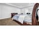 Primary bedroom featuring a plush bed, natural light, and an attached ensuite at 307 Ernest Ave, Peachtree City, GA 30269