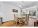 Bright dining area with modern light fixture, large windows, and hardwood flooring at 307 Ernest Ave, Peachtree City, GA 30269