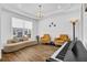 Bright living room with hardwood floors, neutral colors, and modern furniture, including piano at 307 Ernest Ave, Peachtree City, GA 30269