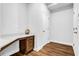Small office space with built in desk, wood floors and white walls at 307 Ernest Ave, Peachtree City, GA 30269