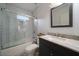 Modern bathroom featuring a tiled shower, granite vanity and stylish mirror at 3412 Orchard St, Atlanta, GA 30354