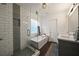 Beautiful bathroom featuring a soaking tub, a glass shower, and modern fixtures at 3412 Orchard St, Atlanta, GA 30354