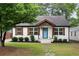 Charming home with a well-maintained lawn, stone pathway, and a delightful blue front door at 3412 Orchard St, Atlanta, GA 30354