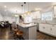 Bright kitchen features an island with granite countertops and stainless steel appliances at 3412 Orchard St, Atlanta, GA 30354