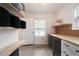 Bright laundry room boasts ample shelving, storage, and a convenient folding counter at 3412 Orchard St, Atlanta, GA 30354