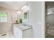 Bathroom showcasing double vanity with granite countertops, mirrors, and stylish lighting at 407 Yellowstone Dr, Powder Springs, GA 30127