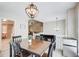 Dining area with direct access to the living room, neutral colors, and modern fixtures at 407 Yellowstone Dr, Powder Springs, GA 30127