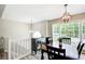 Open-concept dining area featuring modern lighting and hardwood flooring at 407 Yellowstone Dr, Powder Springs, GA 30127