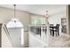 Bright dining area with stylish light fixtures, views to the main entrance and hardwood flooring at 407 Yellowstone Dr, Powder Springs, GA 30127