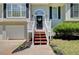 Inviting front entrance showcasing a well-maintained walkway and a charming front door at 407 Yellowstone Dr, Powder Springs, GA 30127