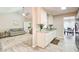 Modern kitchen featuring white cabinets, granite countertops, and stainless-steel appliances at 407 Yellowstone Dr, Powder Springs, GA 30127