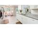 Eat-in kitchen featuring white cabinets and granite countertops at 407 Yellowstone Dr, Powder Springs, GA 30127