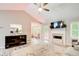 Bright living room featuring vaulted ceilings, a fireplace, and a view of the adjacent dining area at 407 Yellowstone Dr, Powder Springs, GA 30127