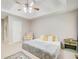 Bright main bedroom featuring tray ceilings, a ceiling fan, and neutral decor at 407 Yellowstone Dr, Powder Springs, GA 30127