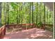 Enjoy this spacious back deck overlooking a lush green forest, perfect for outdoor relaxation and entertaining at 191 Orchard Dr, Canton, GA 30115