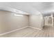 Minimalist open space with new floors, neutral paint, and a drop ceiling, ready for customization at 191 Orchard Dr, Canton, GA 30115