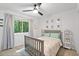 Charming bedroom with curtains and artwork at 2435 Roxburgh Dr, Roswell, GA 30076
