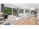 Eat-in kitchen with large sliding glass doors to deck offering views of wooded backyard at 2435 Roxburgh Dr, Roswell, GA 30076