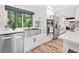 Kitchen featuring modern stainless steel appliances, sink beneath a window, and ample counter space at 2435 Roxburgh Dr, Roswell, GA 30076