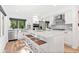 Modern kitchen featuring a center island with seating, stainless steel appliances, and granite countertops at 2435 Roxburgh Dr, Roswell, GA 30076
