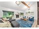 Inviting living room featuring a brick fireplace, shiplap walls, and natural lighting at 2435 Roxburgh Dr, Roswell, GA 30076