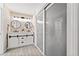Bright primary bathroom with double sink vanity, shiplap walls, and a modern walk-in shower at 2435 Roxburgh Dr, Roswell, GA 30076