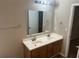 Bathroom with a double sink vanity and a large mirror at 4963 Windsor Downs Ln, Decatur, GA 30035