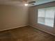 Bedroom with neutral walls and carpet, a ceiling fan, and a window at 4963 Windsor Downs Ln, Decatur, GA 30035