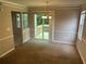 Dining room area with a chandelier and sliding glass doors leading to a wooden deck at 4963 Windsor Downs Ln, Decatur, GA 30035