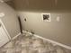 Practical laundry room ready for your appliances, with tile floor, plus water and electrical hookups at 4963 Windsor Downs Ln, Decatur, GA 30035