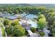 Stunning aerial view of community amenities featuring pools, tennis courts, and lush landscaping for an active lifestyle at 979 Pathview Ct, Dacula, GA 30019