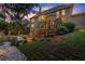 Expansive backyard with pool, spa, stone retaining walls, deck, and lush landscaping at 979 Pathview Ct, Dacula, GA 30019