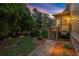 Charming backyard with a deck, beautiful landscaping, and a well-maintained lawn at 979 Pathview Ct, Dacula, GA 30019