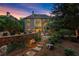 Backyard exterior elevation with stone landscaping, patio, and outdoor seating at 979 Pathview Ct, Dacula, GA 30019