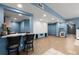 Spacious basement with bar, countertop seating, and finished floors, perfect for entertaining at 979 Pathview Ct, Dacula, GA 30019