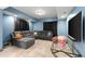 Cozy basement entertainment space with a sectional sofa and a popcorn machine at 979 Pathview Ct, Dacula, GA 30019