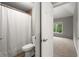 View of bathroom featuring a toilet and a shower/tub combo at 979 Pathview Ct, Dacula, GA 30019