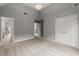 Bedroom featuring neutral paint, carpet, vaulted ceiling, and two closets at 979 Pathview Ct, Dacula, GA 30019