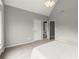 View of bedroom with an ensuite bathroom, carpet, and neutral paint at 979 Pathview Ct, Dacula, GA 30019