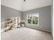 Bedroom with a vaulted ceiling and a window overlooking the backyard at 979 Pathview Ct, Dacula, GA 30019