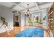 Bright dining room features hardwood floors, chandelier, and bay window at 979 Pathview Ct, Dacula, GA 30019