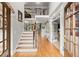 Elegant foyer with hardwood floors, staircase, and natural light at 979 Pathview Ct, Dacula, GA 30019