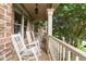 Cozy front porch with white rocking chairs, offering a relaxing outdoor space at 979 Pathview Ct, Dacula, GA 30019