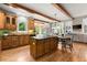 Modern kitchen with wood cabinets, granite countertops, and hardwood floors at 979 Pathview Ct, Dacula, GA 30019