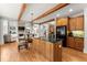 Kitchen with center island, wood cabinets, granite countertops, and hardwood floors at 979 Pathview Ct, Dacula, GA 30019