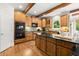 Well-appointed kitchen with granite countertops, stainless steel appliances, hardwood floors, and custom cabinetry at 979 Pathview Ct, Dacula, GA 30019